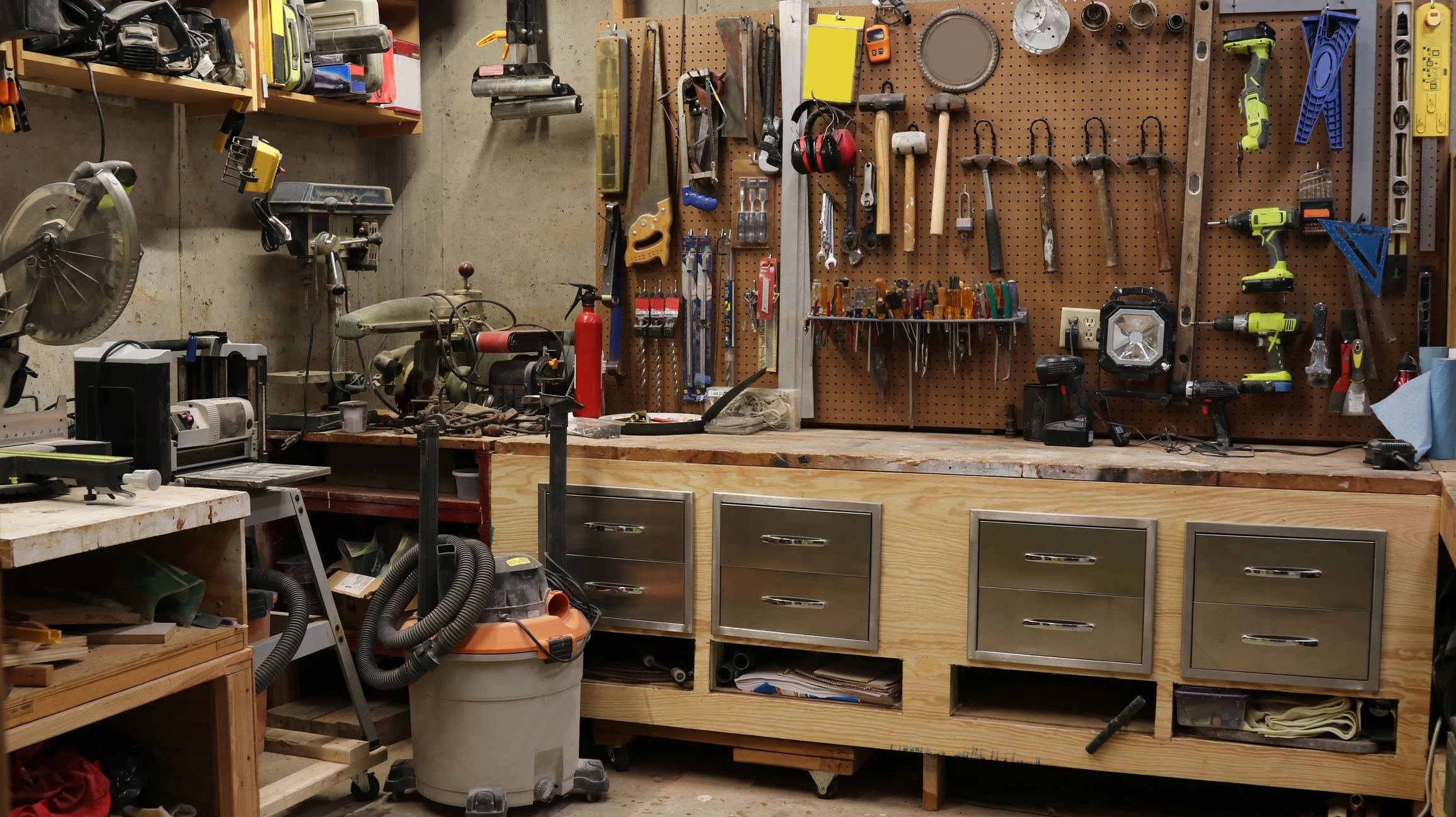 Leather craft tools arranged on a workshop bench