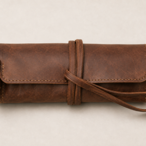 Chestnut brown leather Benchline Tool Roll rolled closed with a long leather wrap strap and fold over protective flap