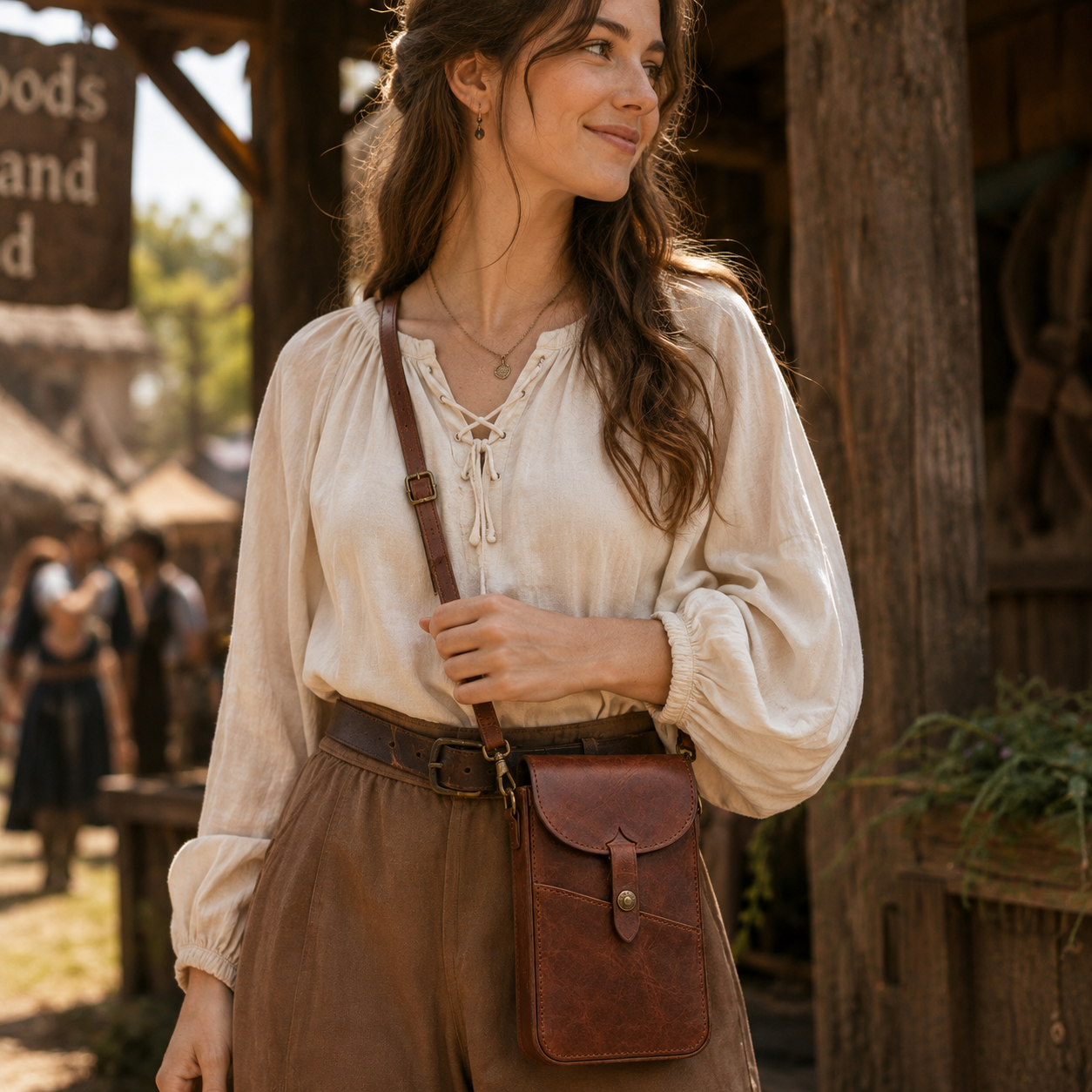 Lifestyle - Old Line Crafts & Designs Person wearing the brown leather Marketline Crossbody Bag at a rustic outdoor market showing the bag scale and crossbody carry position