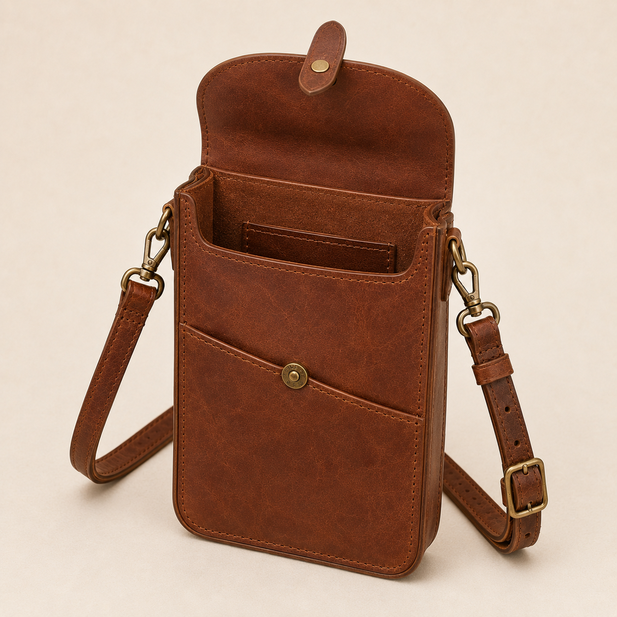 Open - Old Line Crafts & Designs Open brown leather Marketline Crossbody Bag showing the main compartment interior organization flap side hardware and front utility pocket