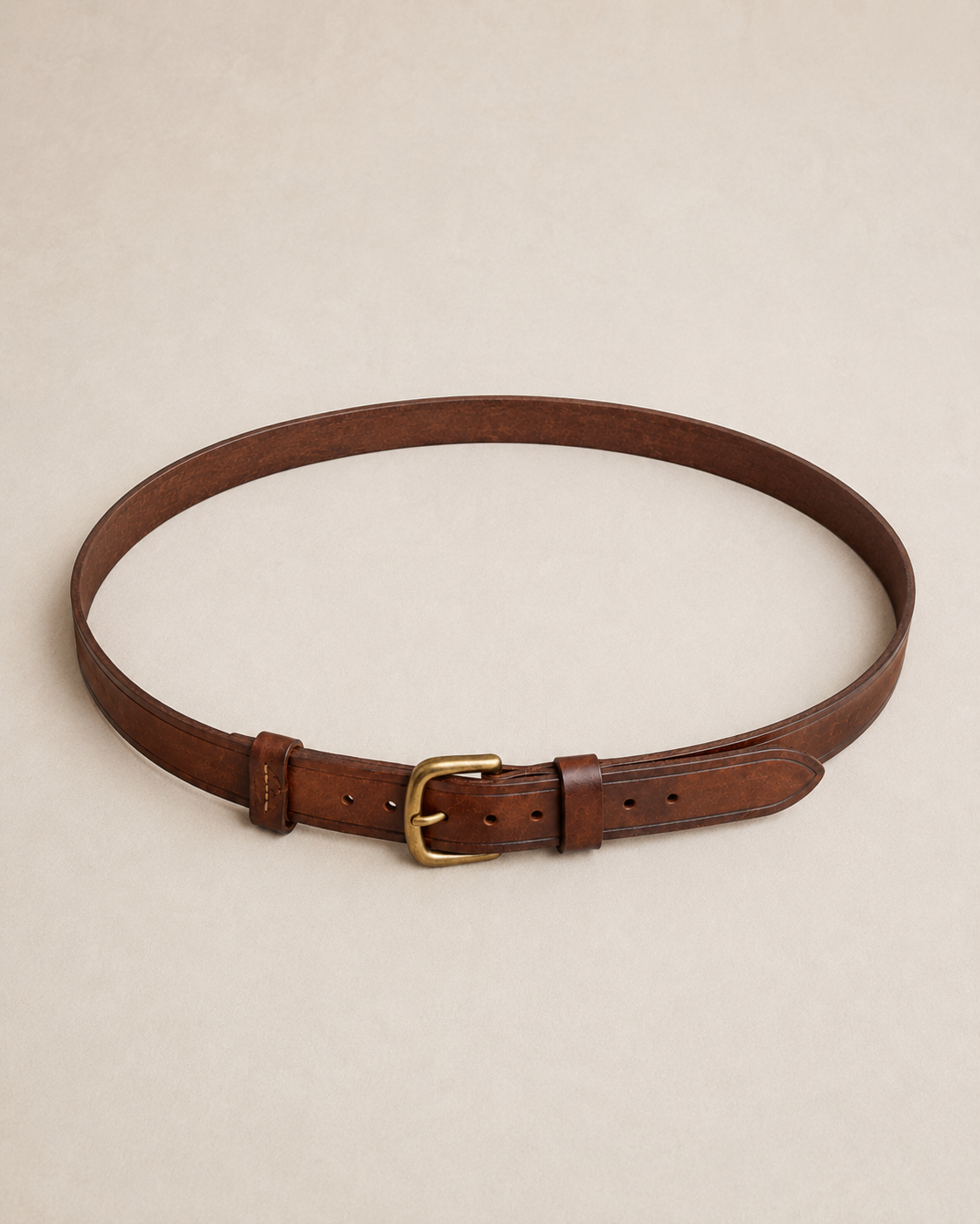 Roadwarden_Utility_Belt_Gallery_Full_View - Old Line Crafts & Designs Full circular view of a brown leather utility belt with brass buckle seven adjustment holes keeper loops and shaped tail