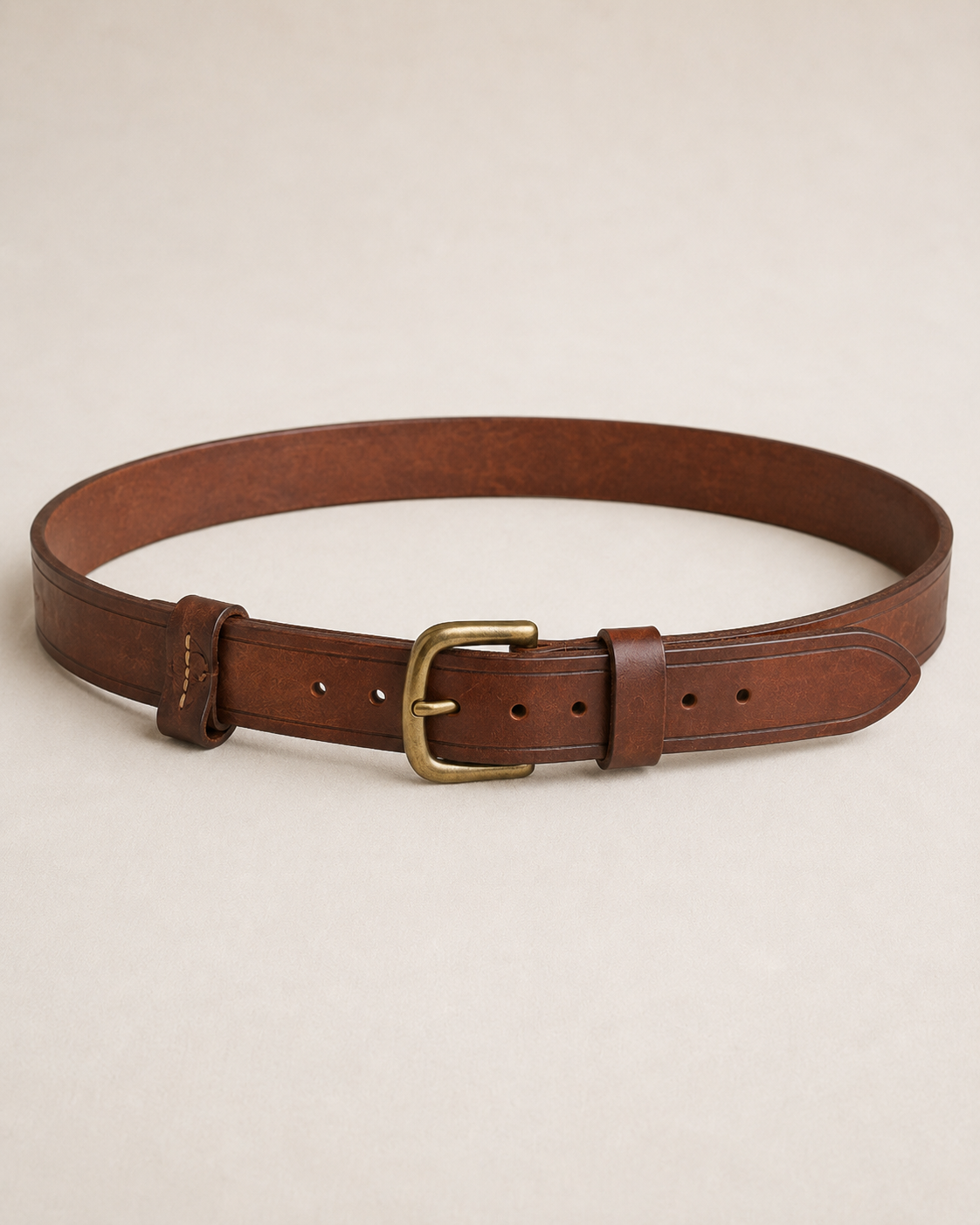 Roadwarden_Utility_Belt_Hero - Old Line Crafts & Designs Brown leather Roadwarden Utility Belt with brass tongue buckle stitched keeper pointed tail and movable leather Field Loops on a light studio background